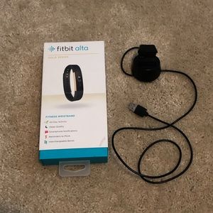 Fitbit Alta w/ 11 interchangeable bands. Includes charger and original box.